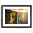 Black framed landscape print showcasing dramatic cliffs and serene sky, elegantly matted for a refined look, perfect for home decor or office spaces.