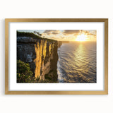 Framed landscape art featuring dramatic cliffs and a gold mat, perfect for enhancing home decor. This elegant piece adds sophistication to any room's aesthetic.