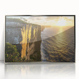 Framed acrylic artwork depicting dramatic cliffs under a vibrant sunset, showcasing rich colors and textures, perfect for enhancing modern home decor.