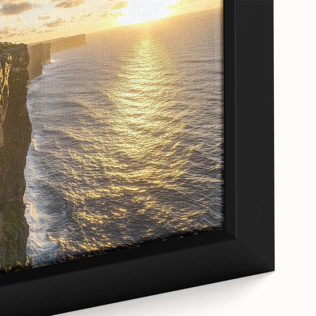 Close-up of a framed canvas showcasing a stunning landscape of rugged cliffs against a vibrant sunset, emphasizing rich colors and intricate details, perfect for home decor.