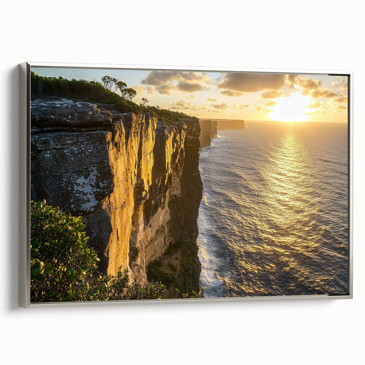 Framed canvas art depicting a scenic landscape of cliffs under a vibrant sky, showcasing silver accents on the frame for an elegant touch. Perfect for enhancing home decor.