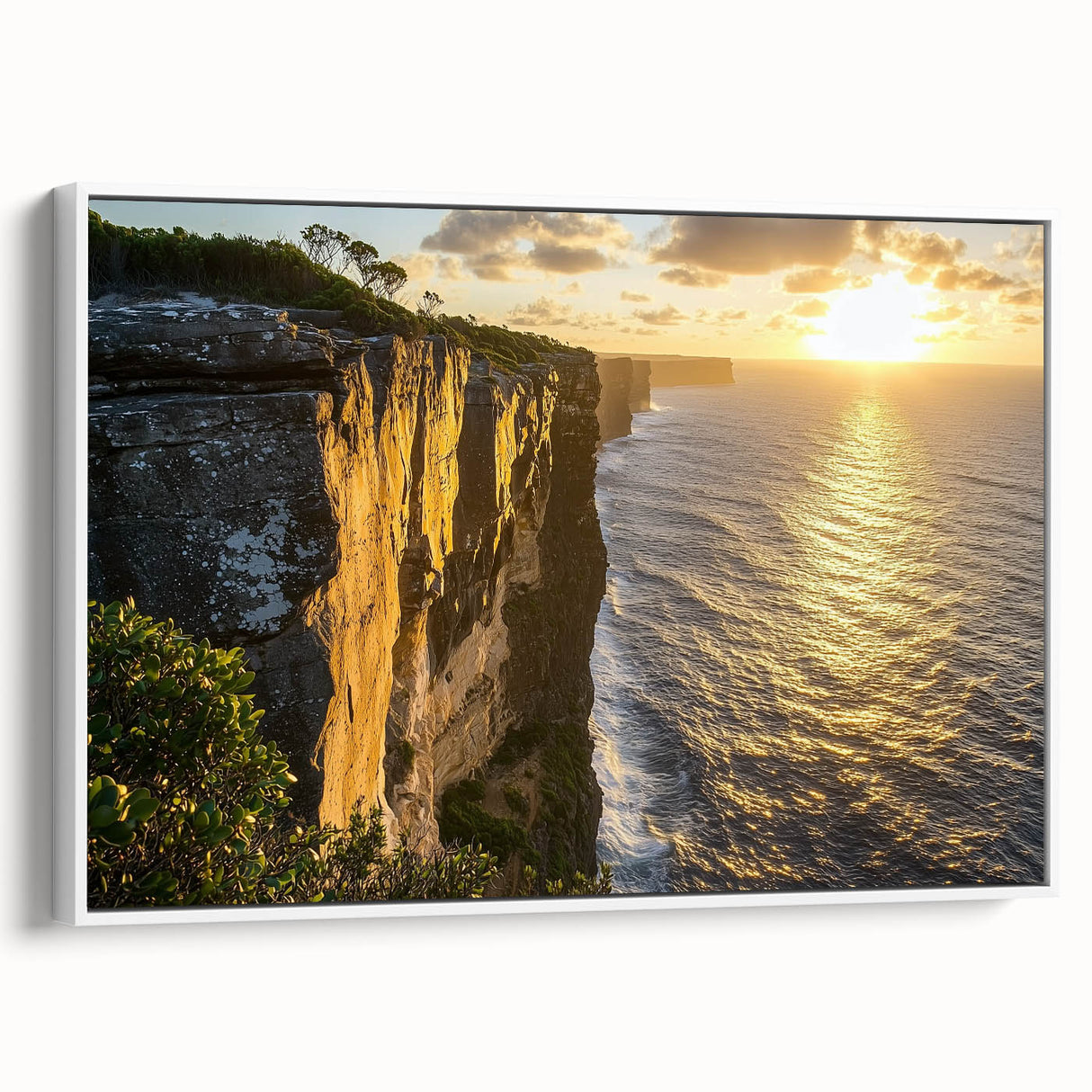 Framed canvas artwork depicting dramatic cliffs and landscapes in vibrant colors, showcasing a white frame that enhances its modern aesthetic, ideal for home decor.