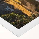 Vibrant rolled canvas depicting stunning coastal cliffs at sunset, showcasing rich colors and textures, ideal for enhancing modern home decor.