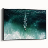 Framed canvas artwork showcasing a serene beach landscape with vibrant blue skies and gentle waves, presented in a sleek black frame, ideal for home decor.