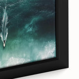 Framed canvas artwork depicting a serene beach landscape with soft pastel colors, showcasing gentle waves and a tranquil sky, ideal for coastal decor enthusiasts.