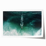 Vibrant landscape print showcasing a serene beach scene with soft waves and golden sand, rolled and packaged in a protective cardboard tube for easy shipping.