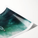 Vibrant rolled print depicting a serene beach landscape, showcasing soft sand, gentle waves, and a clear blue sky, ideal for coastal decor enthusiasts.