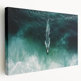 Stretched canvas artwork showcasing a vibrant beach landscape in warm tones, highlighting gentle waves and a serene sky, perfect for coastal-themed decor.
