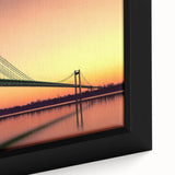 Close-up of a framed landscape canvas featuring a serene bridge over calm waters, surrounded by lush greenery and vibrant blue skies, perfect for home decor.