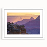 Landscape art print of vibrant canyons framed with a white mat, showcasing rich colors and dramatic rock formations, perfect for enhancing home decor.