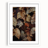 Abstract art print featuring swirling autumn colors in a white framed mat, suitable for dining or bedroom decor.