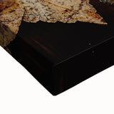 Large art of a black and white landscape painting on stretched canvas, featuring serene tree silhouettes.