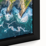 Close-up view of a framed canvas artwork depicting a dramatic landscape with towering cliffs, vibrant colors, and intricate details, perfect for enhancing home decor.