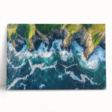Stretched canvas artwork depicting vibrant cliffs and lush landscapes, leaning against a wall, showcasing rich colors and intricate details for home decor.
