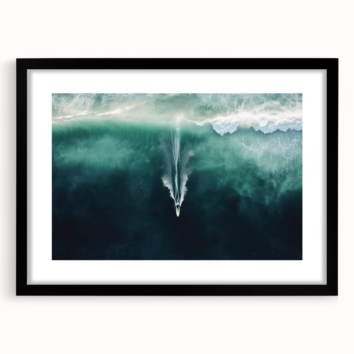 Black-framed landscape artwork featuring serene beach scene with soft waves and golden sand, ideal for coastal home decor and enhancing interior aesthetics.
