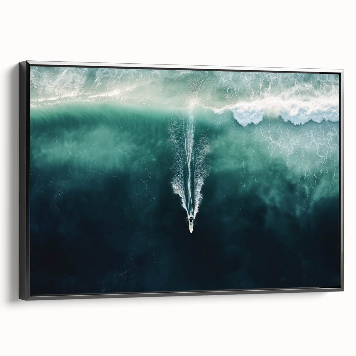 Framed canvas artwork showcasing a serene beach landscape with soft blue skies and gentle waves, presented in a sleek black frame for an elegant touch. Ideal for coastal-themed decor.