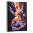 Framed canvas artwork showcasing a breathtaking landscape of canyons in vibrant colors, set against a sleek black frame, perfect for enhancing modern home decor.