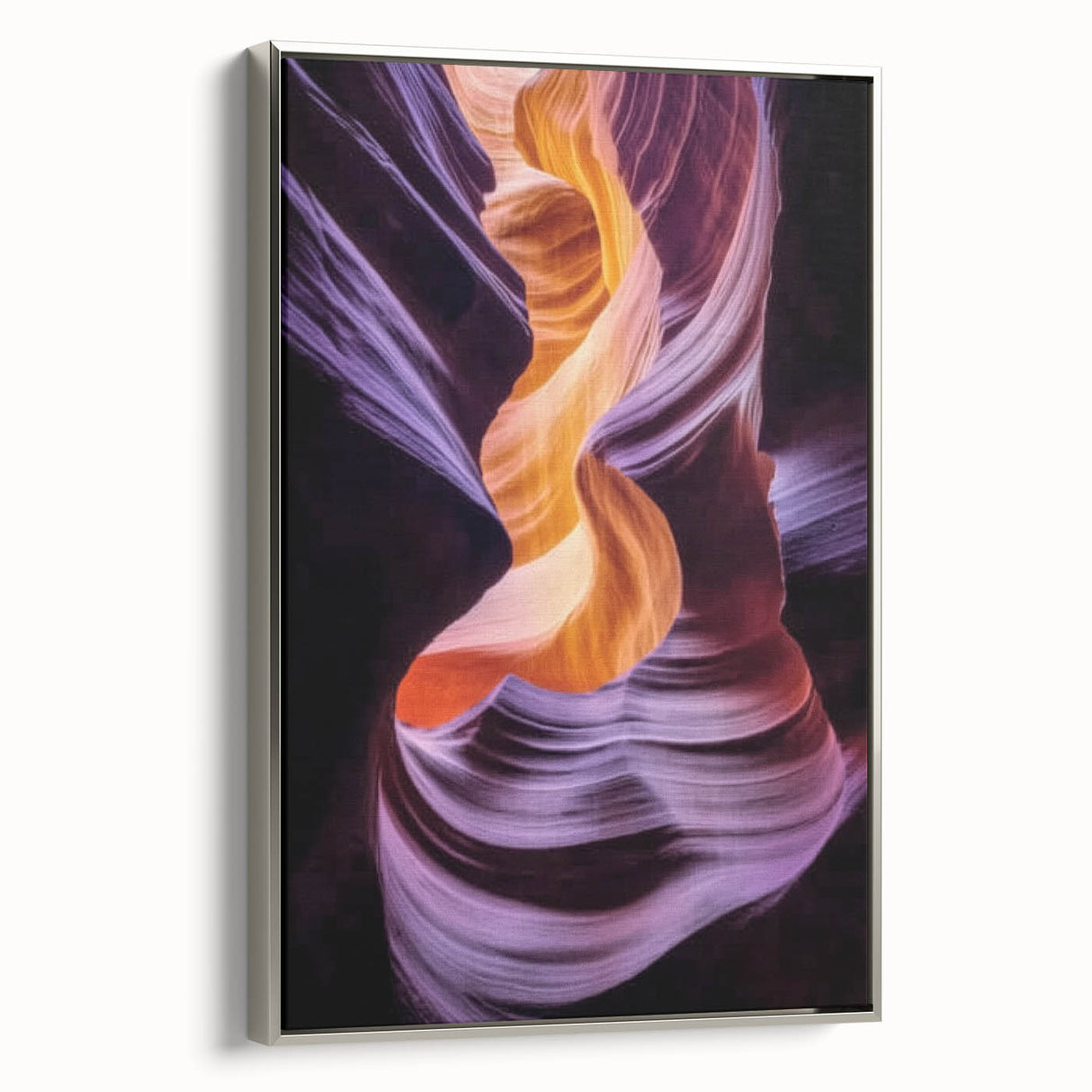 Framed canvas artwork depicting a stunning landscape of canyons, showcasing rich earthy tones and intricate textures, with a sleek silver frame enhancing its visual appeal. Perfect for modern home decor, this piece brings a touch of nature indoors while complementing various interior styles.
