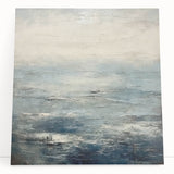 Abstract landscape wall art on stretched canvas, showcasing vibrant colors and dynamic shapes, leaning against a neutral wall in a modern interior setting.