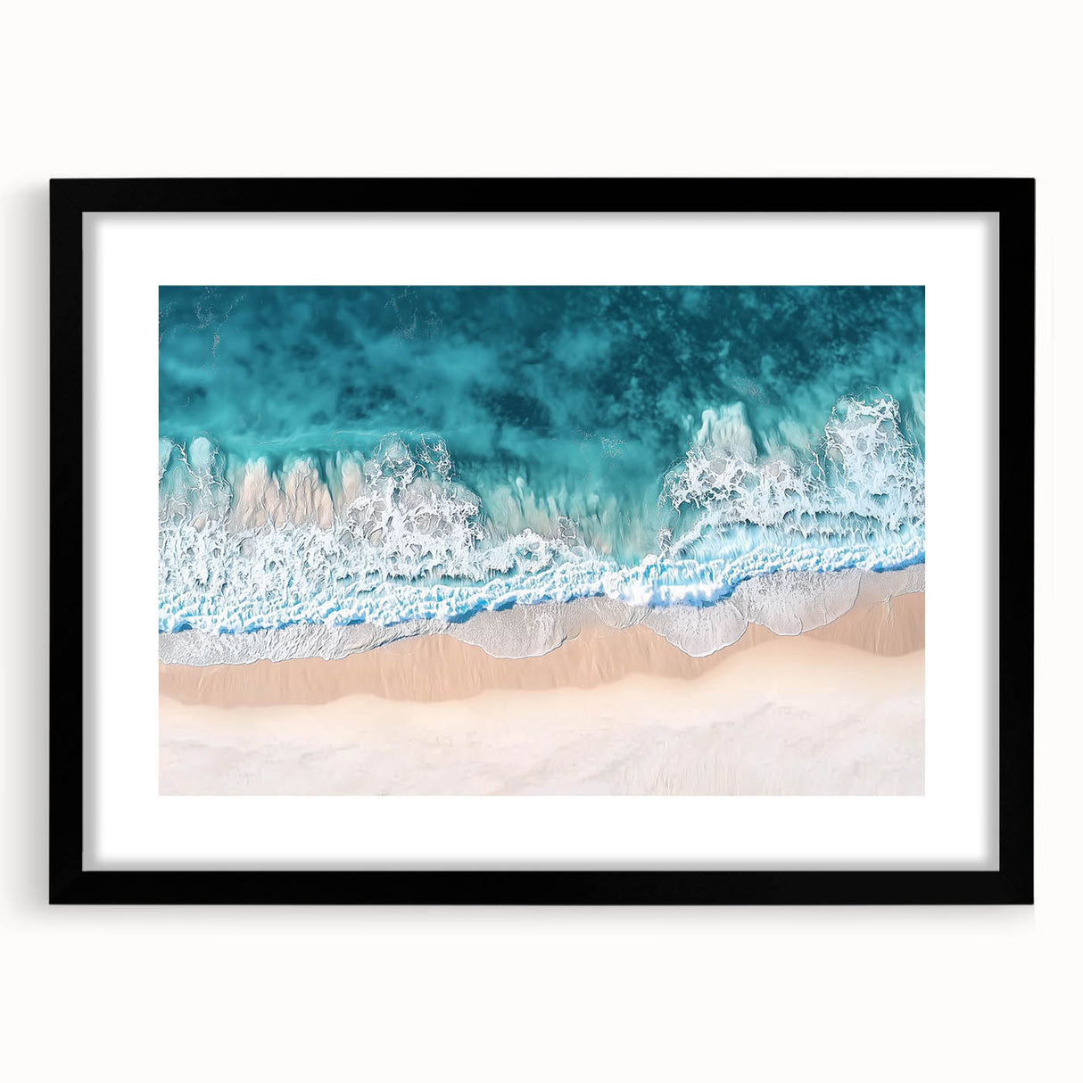 Black-framed landscape artwork depicting a serene beach scene, featuring soft waves and a clear sky, ideal for enhancing home decor with a coastal vibe.