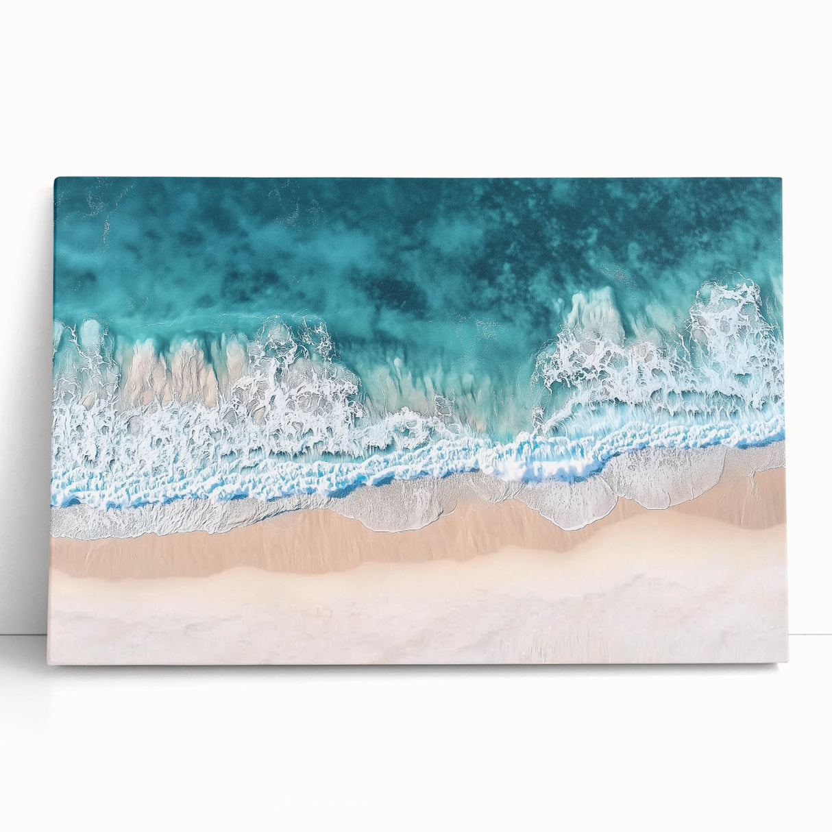 Landscape canvas print showcasing a serene beach scene with vibrant blue waters and soft beige sands, perfect for enhancing coastal-themed decor. Ideal for home or office use, adding a tranquil ambiance and a touch of nature to any space.
