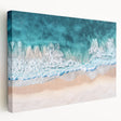 Stretched canvas artwork depicting a serene beach landscape with vibrant colors, showcasing gentle waves and a clear sky, perfect for coastal-themed decor.