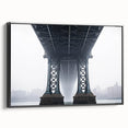 Framed canvas artwork depicting a landscape view of a serene bridge surrounded by lush greenery, featuring a sleek black frame that enhances the natural beauty.