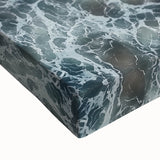 Close-up of a stretched canvas artwork depicting a serene beach landscape, highlighting vibrant colors and intricate details, perfect for coastal home decor.