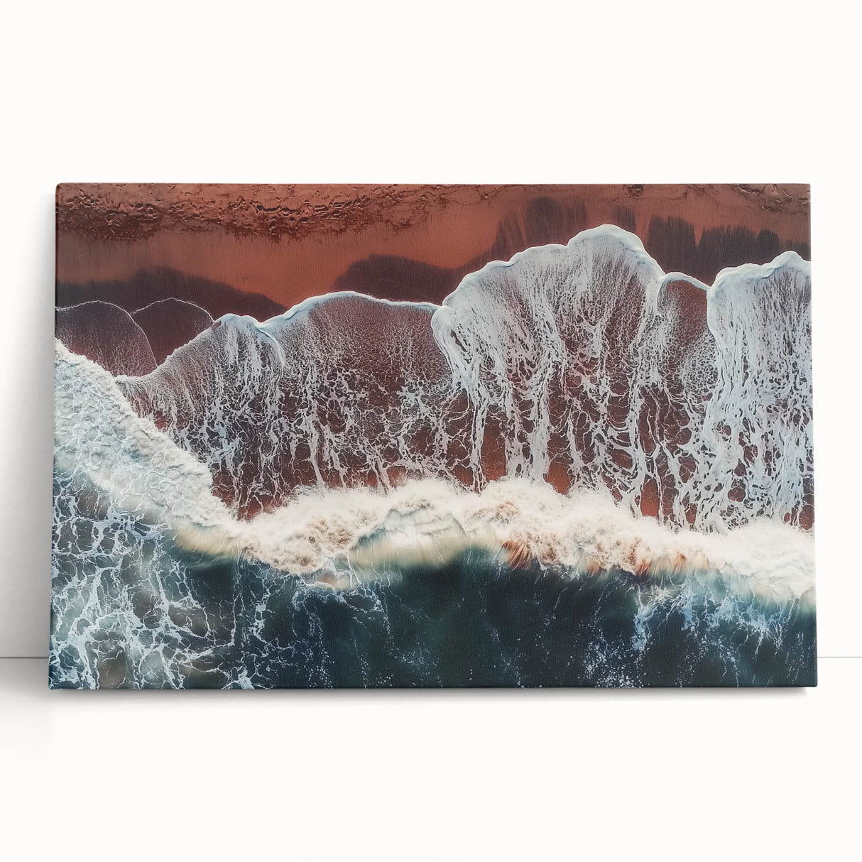 Stretched canvas artwork depicting a serene beach landscape with gentle waves and vibrant blue skies, perfect for coastal home decor and relaxation themes.