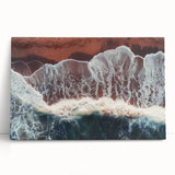 Stretched canvas artwork depicting a serene beach landscape with gentle waves and vibrant blue skies, perfect for coastal home decor and relaxation themes.