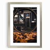 Textured abstract art print in warm autumn hues on a framed silver mat, ideal for bedroom decor.