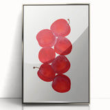 Mid-century modernist art featuring assorted fruits in vibrant colors on a silver-framed acrylic print.