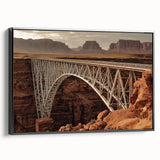 Framed canvas artwork showcasing a serene landscape with a bridge, presented in a black frame. This captivating piece adds a touch of nature-inspired decor to any room.