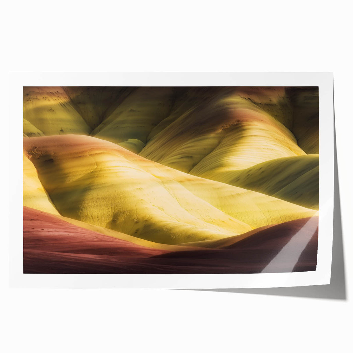Stunning landscape print depicting vibrant canyons in rich earth tones, elegantly rolled for easy display, perfect for home decor or art enthusiasts.