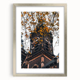 Textured abstract art print depicting autumnal hues on a framed canvas, suitable for bedroom decor.