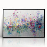 Framed acrylic artwork showcasing an abstract design with vibrant splatters in black and colorful hues, perfect for modern home decor and art enthusiasts.