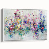 Framed abstract canvas art featuring vibrant splatters in various colors against a white background, showcasing a modern design perfect for contemporary decor.