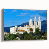 Vintage poster art of an Algerian landscape on a large framed canvas, featuring black and vibrant colorful elements.
