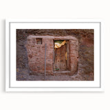 Extra large abstract art print depicting Ethiopian scenery in earth tones on a white framed canvas.