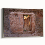 Vintage poster art of an Ethiopian landscape on framed canvas, featuring a silver frame and a palette of earth tones.