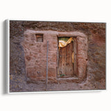 Framed canvas of a vintage Ethiopian landscape in muted earth tones, ideal for bedroom wall art.