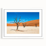 Extra large abstract art print depicting a textured Namibian landscape, with earth tones, framed in white.