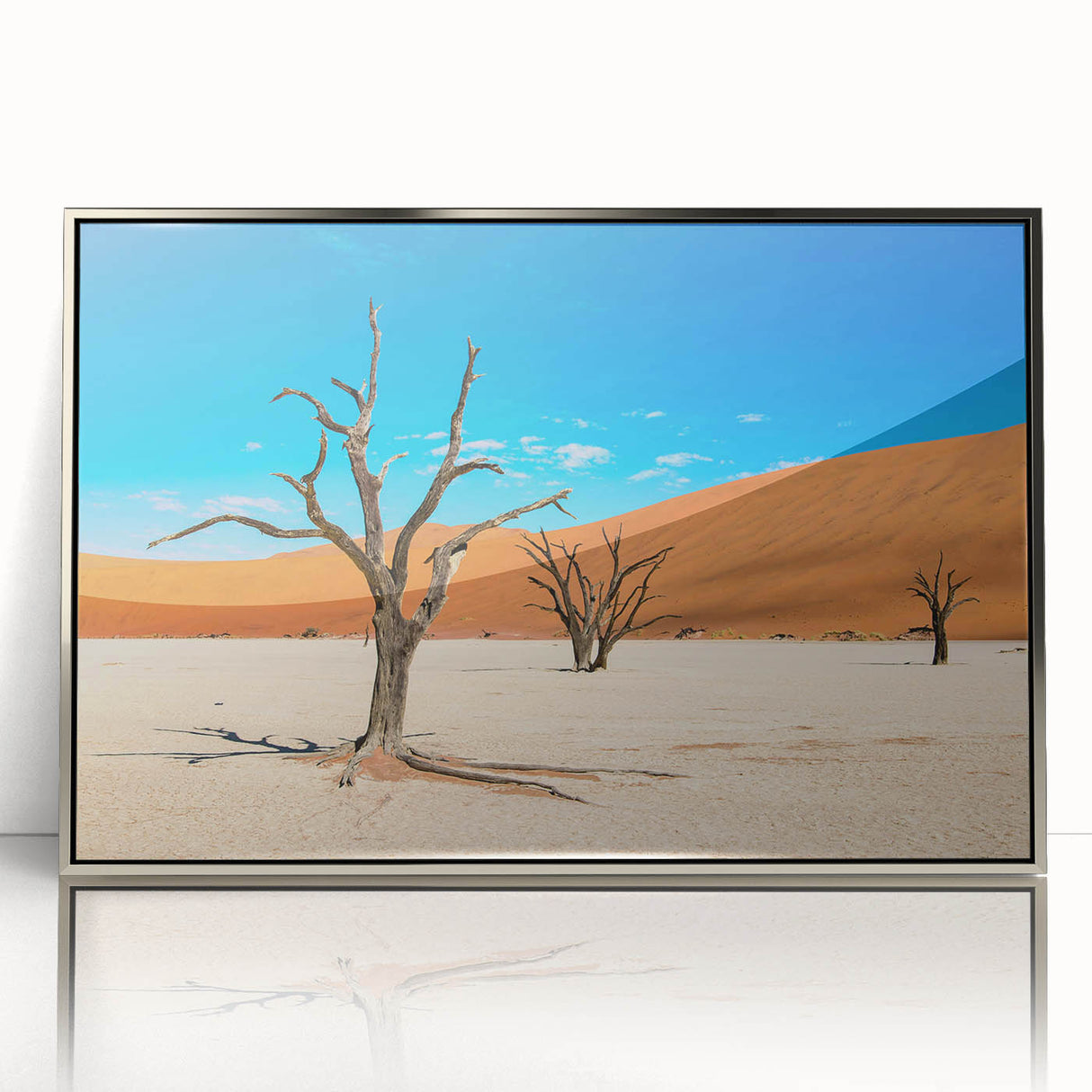 Acrylic print of Namibian landscape with silver frame, featuring soft earth tones, ideal for modern art wall decor.