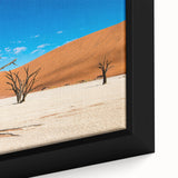 Extra large framed canvas of a textured African scenery in black with colorful accents, ideal for living room decor.