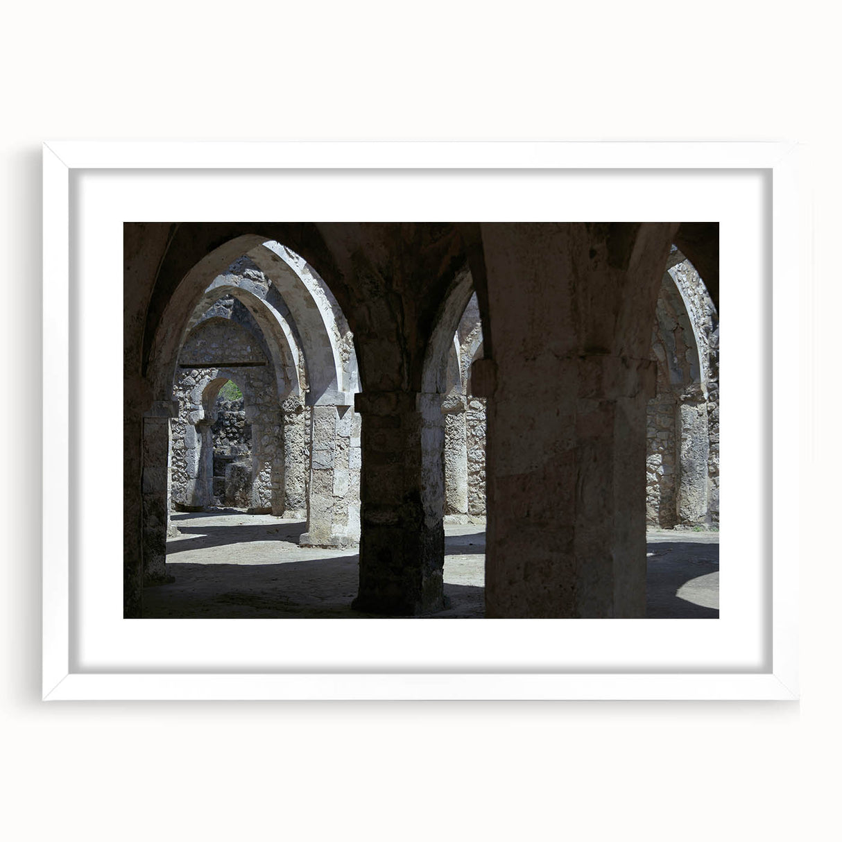 Abstract art print of Tanzanian scenery in muted earth tones on a framed white mat.