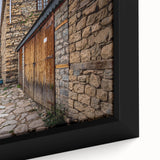 Framed canvas featuring a textured black wall art scene with colorful accents.