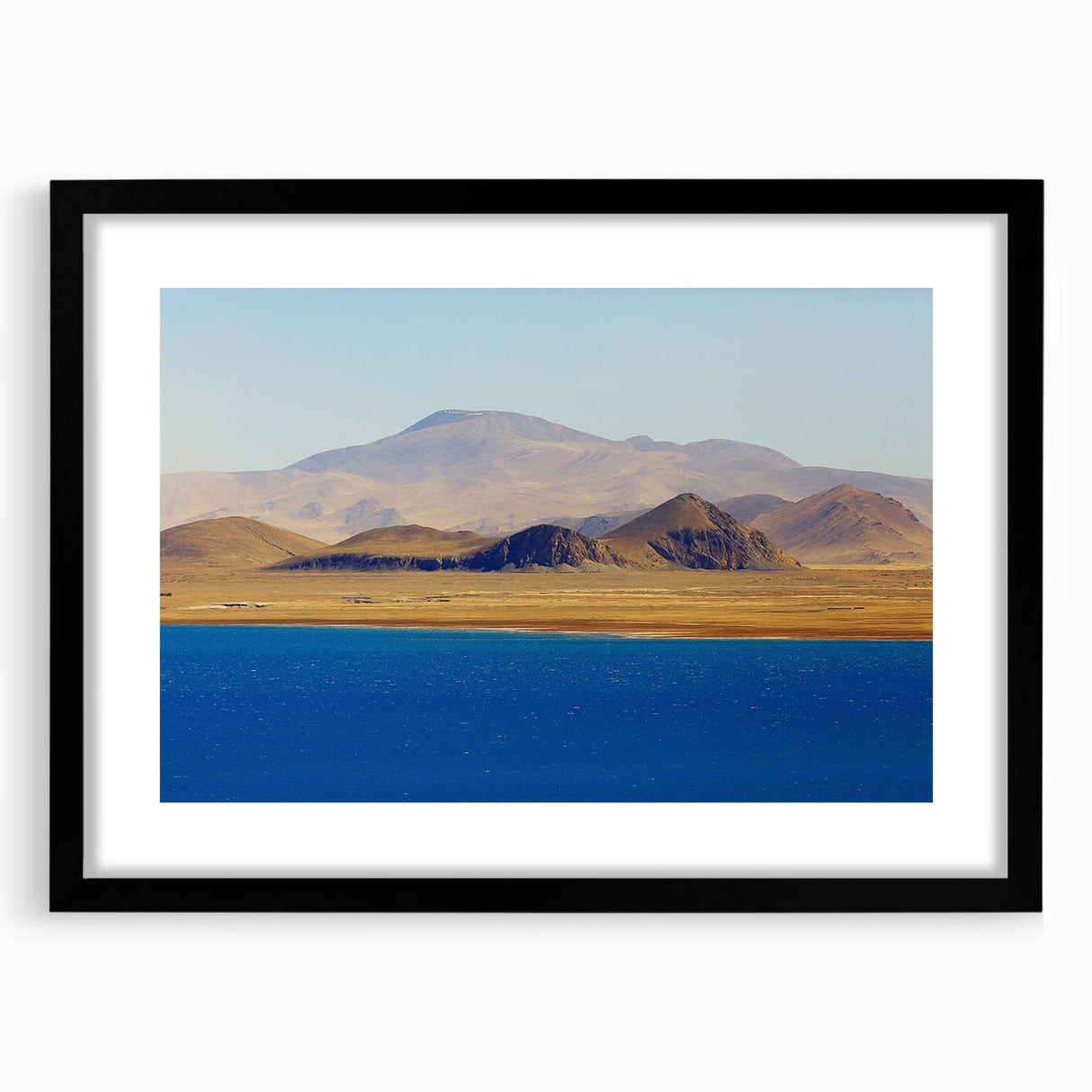 Extra large abstract art print of a colorful Tibetan landscape, textured finish, framed with black mat.