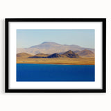 Extra large abstract art print of a colorful Tibetan landscape, textured finish, framed with black mat.