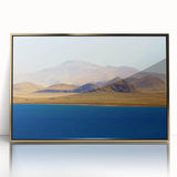 Framed acrylic print of a Tibetan landscape in muted gold and blue tones, ideal for modern art wall decor.
