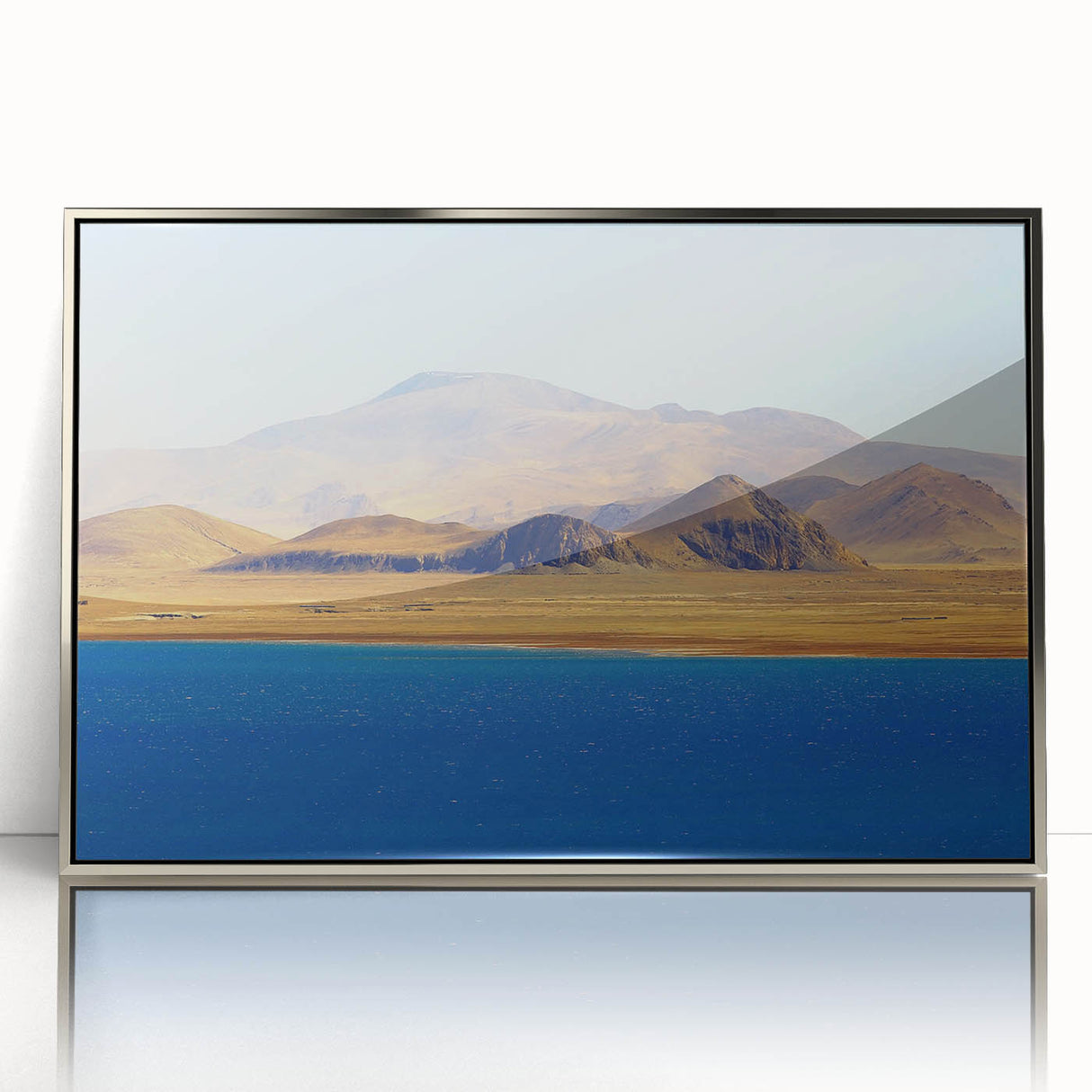 Framed acrylic print of a Tibetan landscape in muted earth tones.